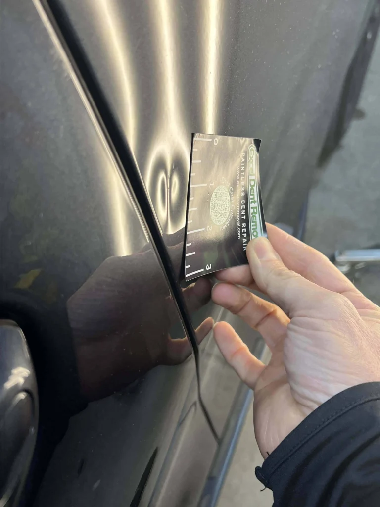 BMW LT Rear Door 2inch dent magnet measure BMW Door Dent showing 2 inch size with EDR magnet guide