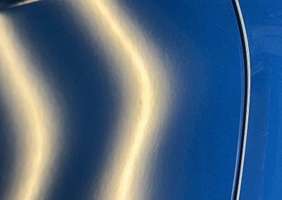 Discover the Benefits of Paintless Dent Repair: Stunning Results for a 2024 Camaro 11 Closeup After PDR for Door Ding Camaro