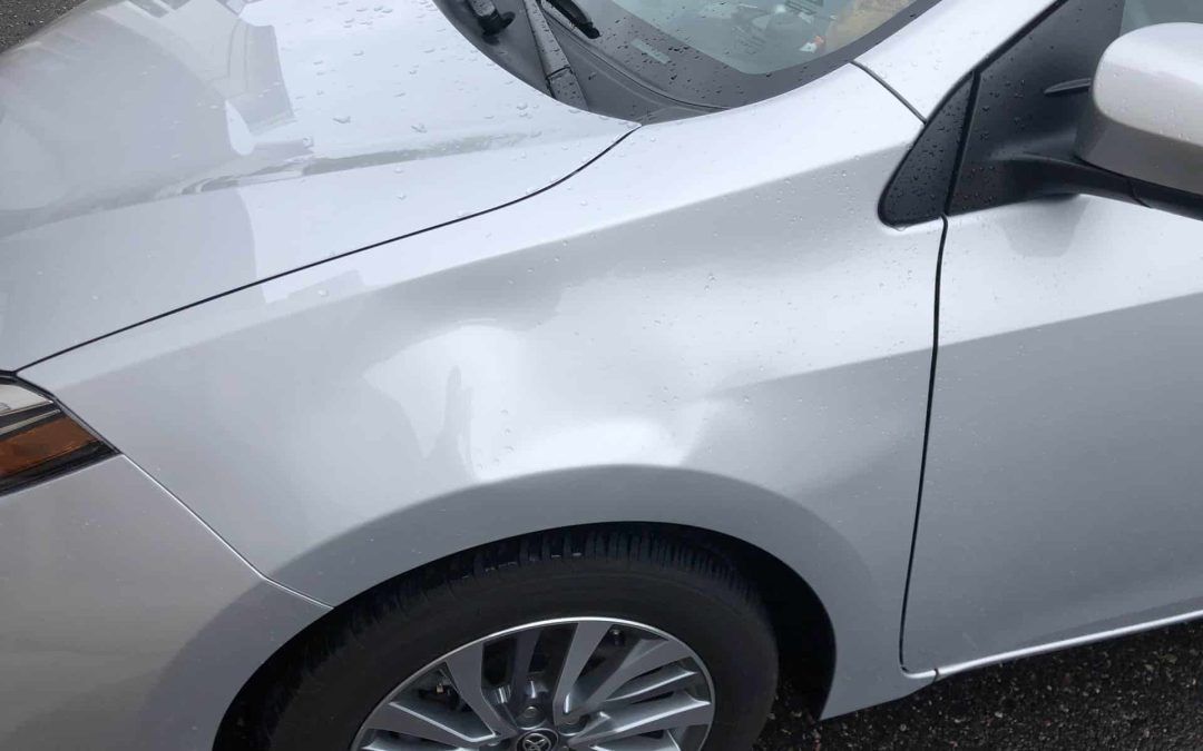 Removing a Large Dent From a Corolla Fender Using PDR