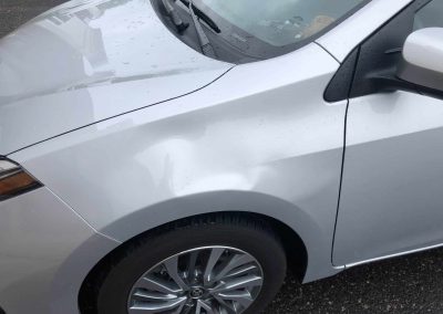 Removing a Large Dent From a Corolla Fender Using PDR