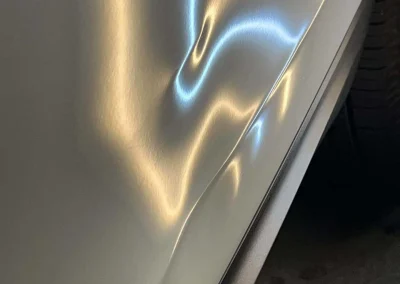 Damage in Door from Impact Beam