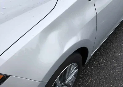 Large Dent In Corolla Left Fender