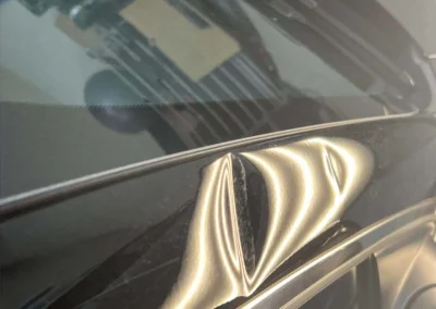 Large Dents in Right Rail from Strom Damage Repaired with Dent Removal