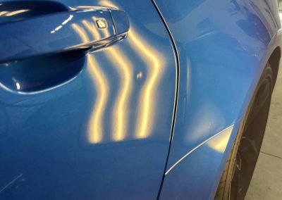 Discover the Benefits of Paintless Dent Repair: Stunning Results for a 2024 Camaro 14 ding in door or camaro